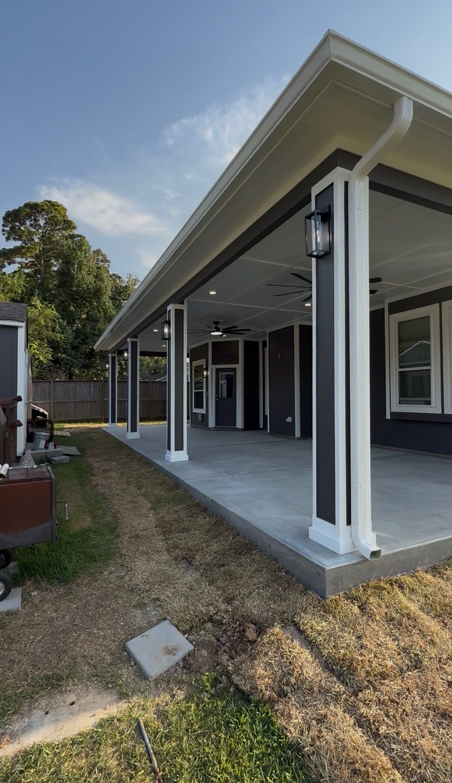 Same backyard after Lira Construction LLC installed a custom patio cover
